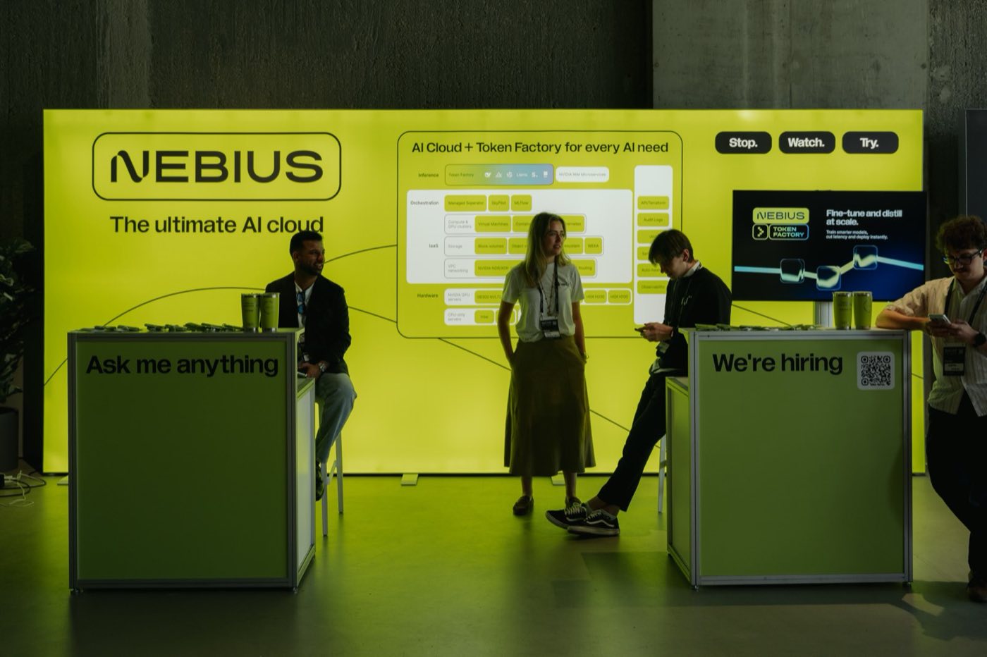 A sponsor stand set up on the coworking floor during an event