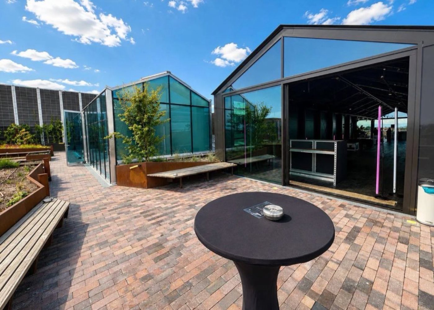 The Pavilion opening onto the Sundowner Terrace, a standing table in front