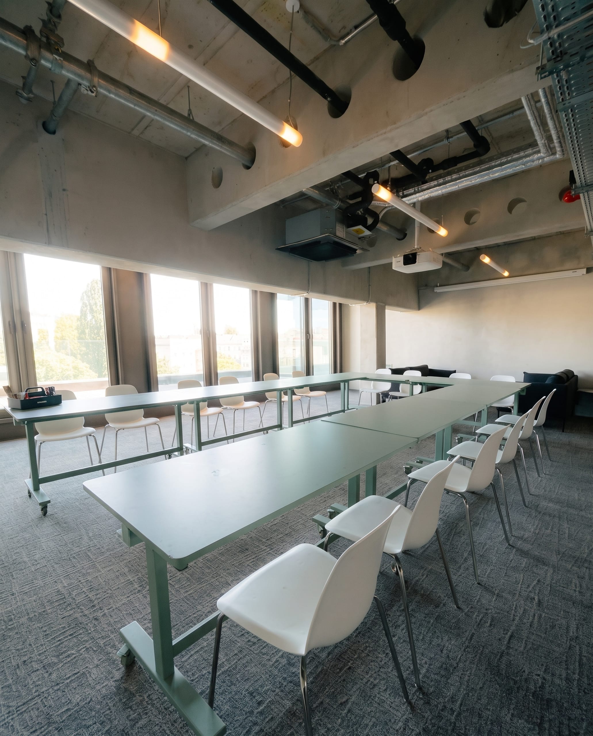 Cosmos set with long tables for a presentation, daylight from the windows
